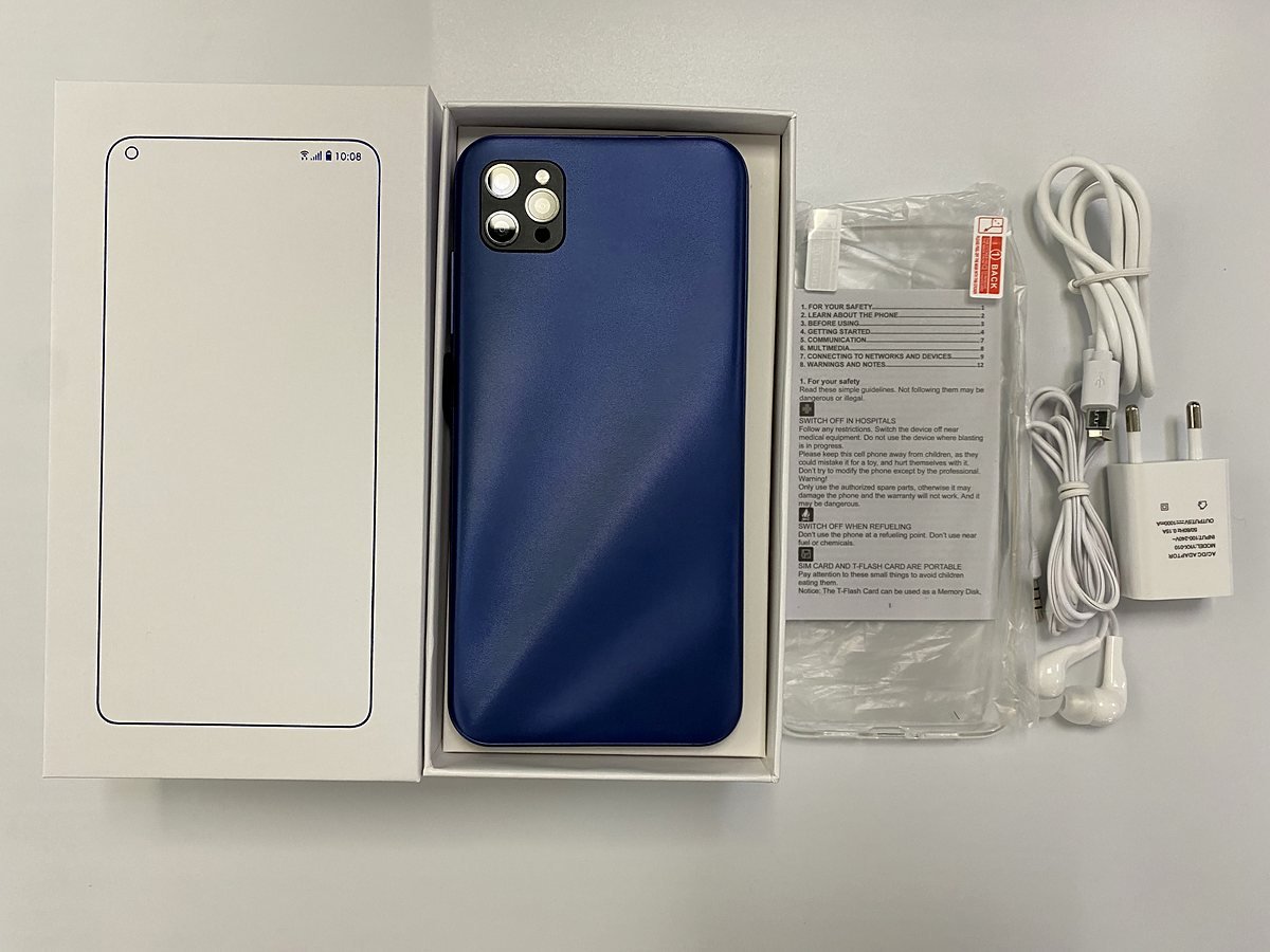 MaxPhone box contents: blue phone, charger, earphones, USB cable and manual